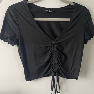 Women's black cinched top. Size medium